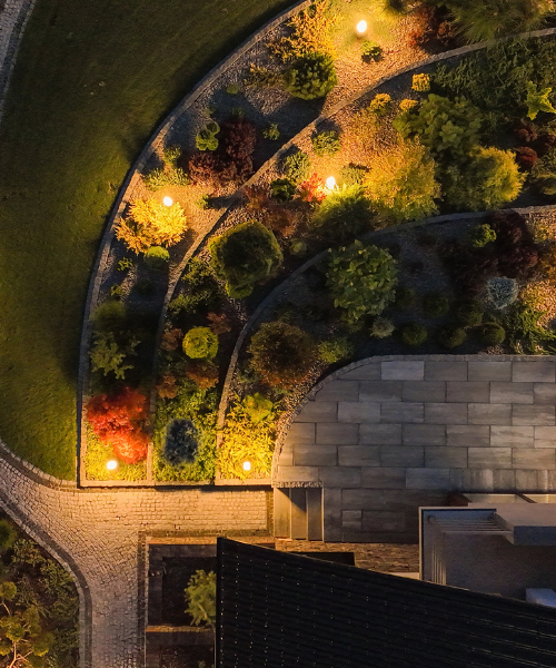 An aerial view of a garden at night